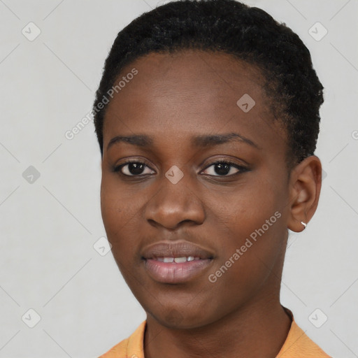 Joyful black young-adult female with short  black hair and brown eyes