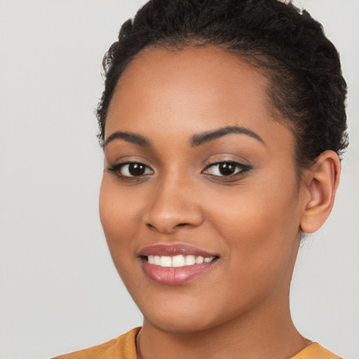 Joyful latino young-adult female with short  brown hair and brown eyes