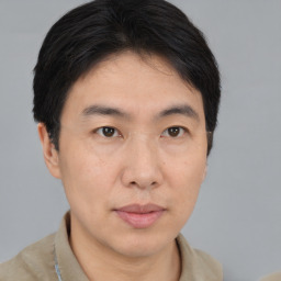 Neutral asian young-adult male with short  brown hair and brown eyes