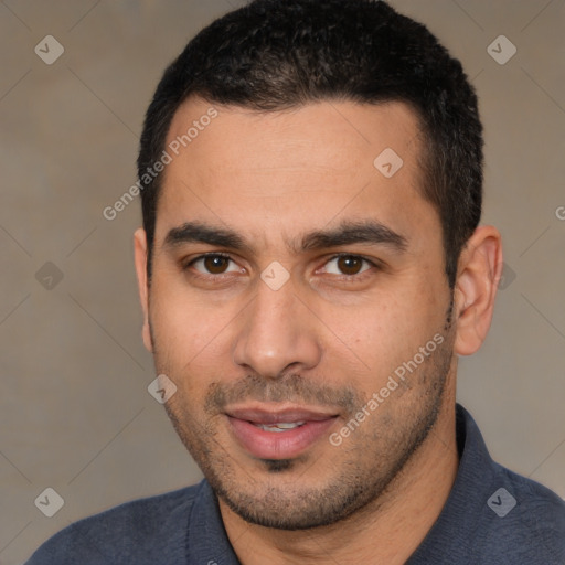 Joyful white young-adult male with short  black hair and brown eyes