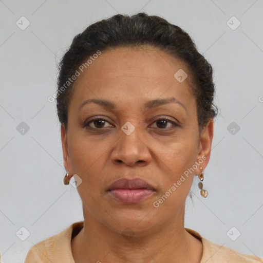 Joyful black adult female with short  brown hair and brown eyes