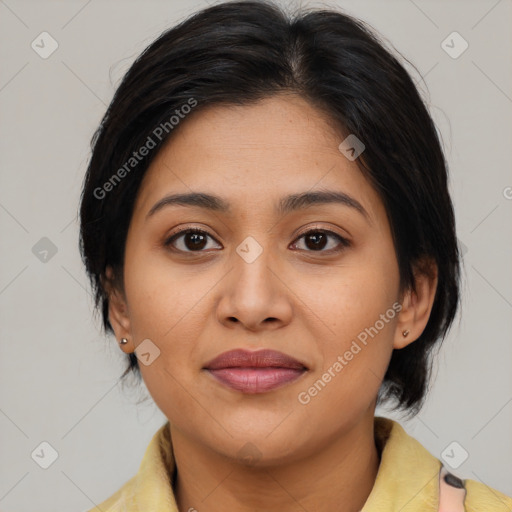 Joyful latino young-adult female with medium  brown hair and brown eyes