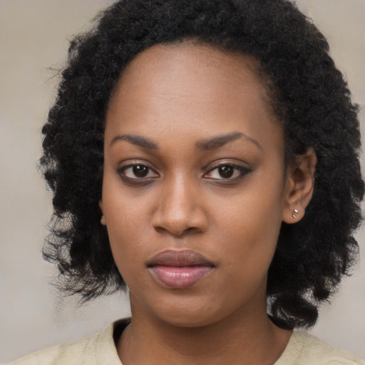 Neutral black young-adult female with long  black hair and brown eyes