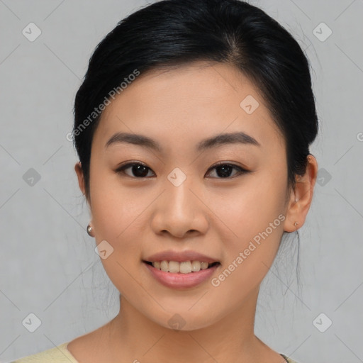 Joyful asian young-adult female with medium  brown hair and brown eyes