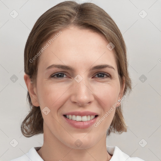 Joyful white young-adult female with medium  brown hair and grey eyes