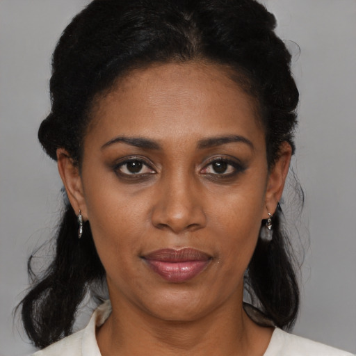 Neutral black adult female with medium  black hair and brown eyes
