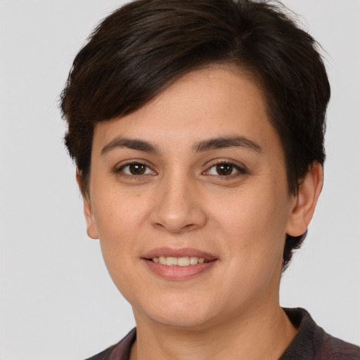 Joyful white young-adult female with short  brown hair and brown eyes