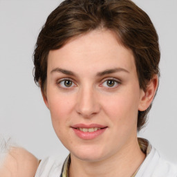 Joyful white young-adult female with medium  brown hair and grey eyes