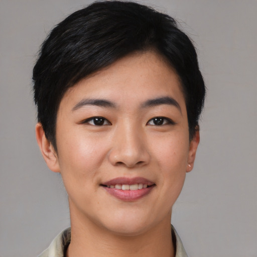 Joyful asian young-adult female with short  black hair and brown eyes