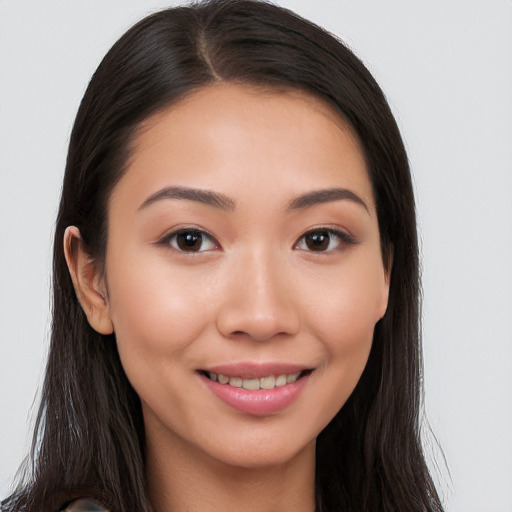 Joyful white young-adult female with long  brown hair and brown eyes