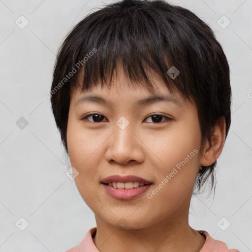 Joyful asian young-adult female with short  brown hair and brown eyes