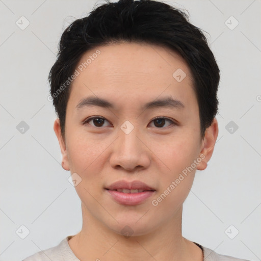 Joyful asian young-adult male with short  brown hair and brown eyes