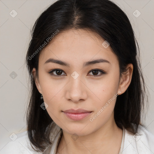 Joyful asian young-adult female with long  brown hair and brown eyes