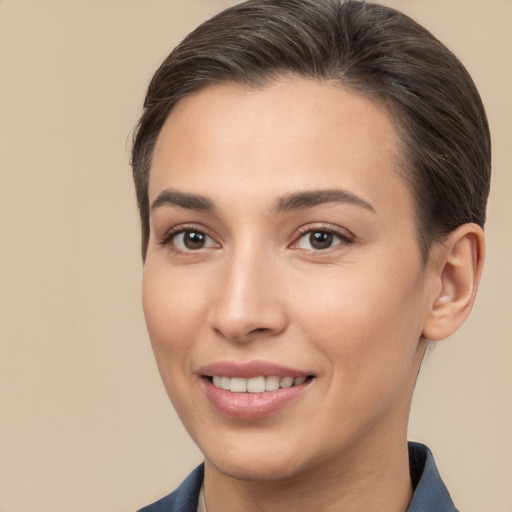 Joyful white young-adult female with short  brown hair and brown eyes