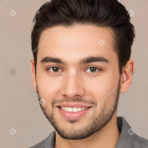 Joyful white young-adult male with short  brown hair and brown eyes