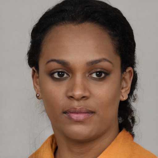 Neutral black young-adult female with short  black hair and brown eyes