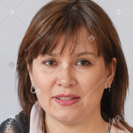 Joyful white adult female with medium  brown hair and brown eyes