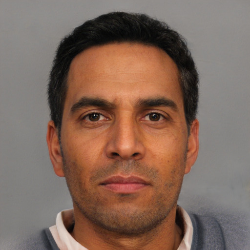 Neutral white adult male with short  black hair and brown eyes