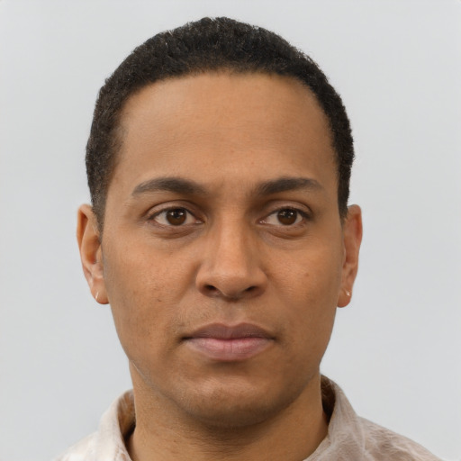 Neutral latino adult male with short  black hair and brown eyes