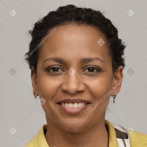 Joyful black young-adult female with short  brown hair and brown eyes