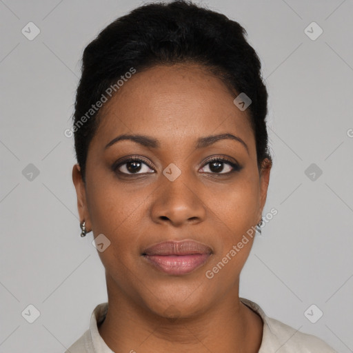 Joyful black young-adult female with short  black hair and brown eyes