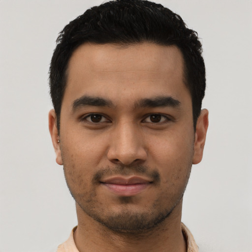 Neutral latino young-adult male with short  black hair and brown eyes