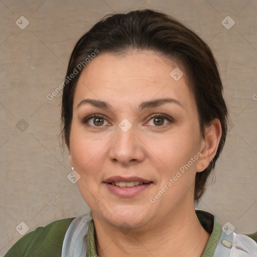 Joyful white adult female with short  brown hair and brown eyes