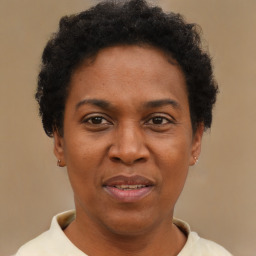 Joyful black adult female with short  brown hair and brown eyes