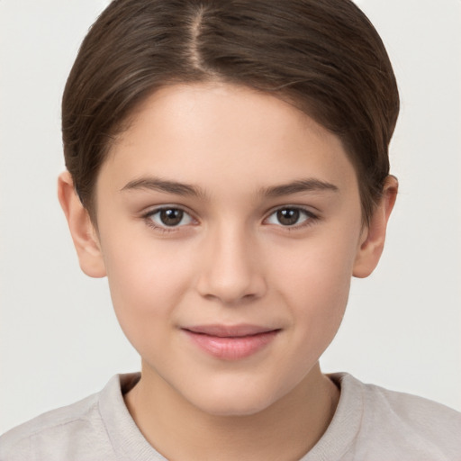 Joyful white child female with short  brown hair and brown eyes