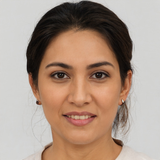 Joyful white young-adult female with medium  brown hair and brown eyes