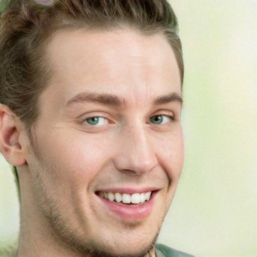 Joyful white young-adult male with long  brown hair and green eyes