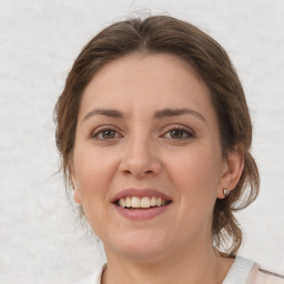 Joyful white young-adult female with medium  brown hair and grey eyes