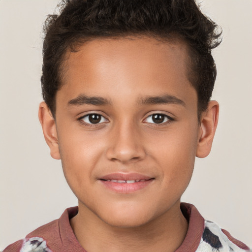 Joyful white child male with short  brown hair and brown eyes