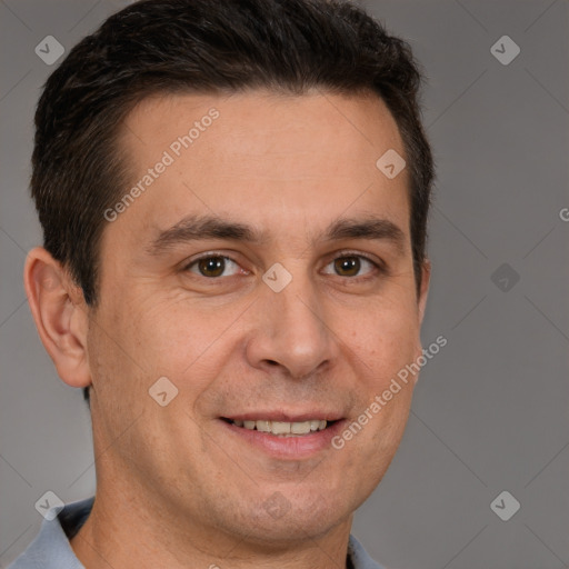 Joyful white adult male with short  brown hair and brown eyes