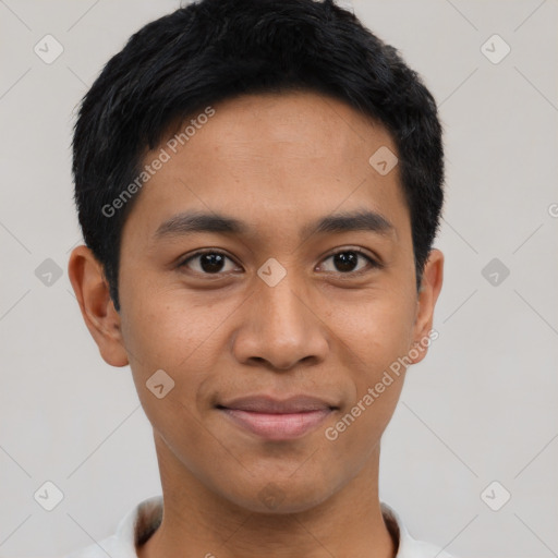 Joyful asian young-adult male with short  black hair and brown eyes