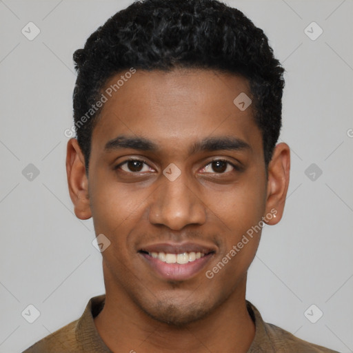 Joyful black young-adult male with short  black hair and brown eyes