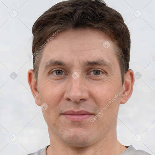 Joyful white adult male with short  brown hair and grey eyes