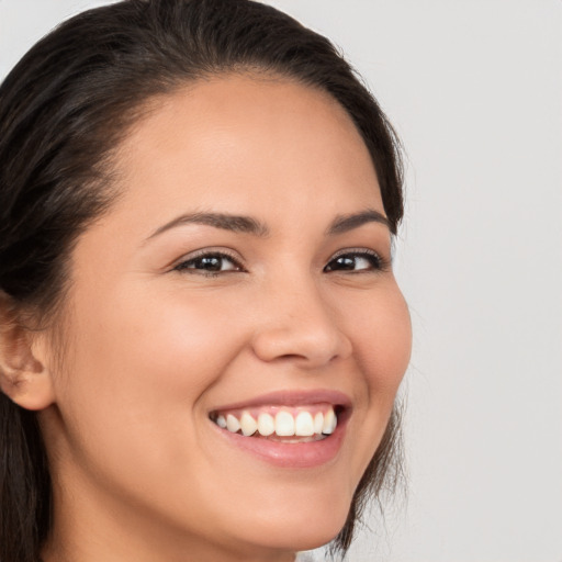 Joyful white young-adult female with medium  brown hair and brown eyes