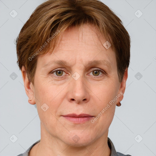 Joyful white adult female with short  brown hair and grey eyes