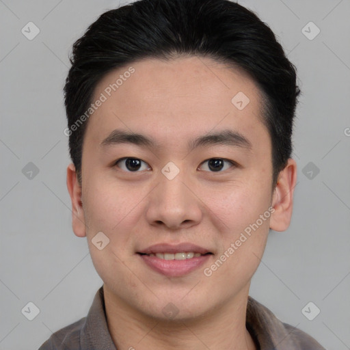 Joyful asian young-adult male with short  black hair and brown eyes