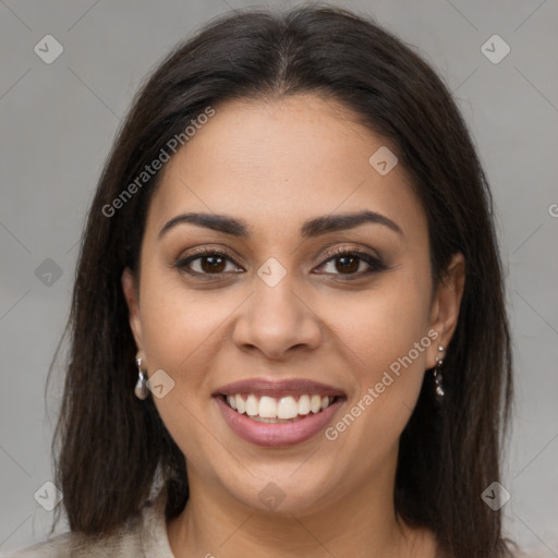 Joyful latino young-adult female with long  brown hair and brown eyes