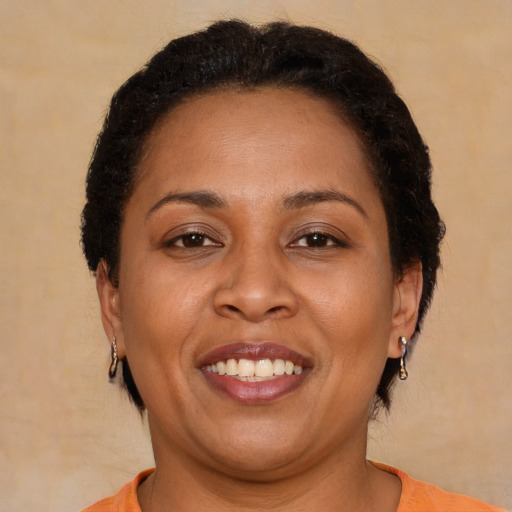 Joyful latino adult female with short  brown hair and brown eyes