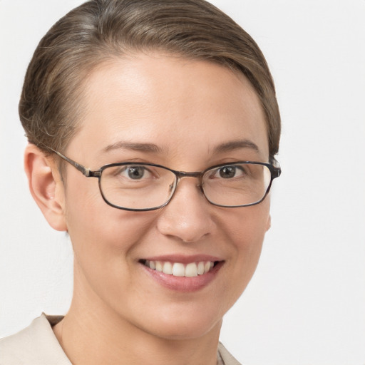 Joyful white young-adult female with short  brown hair and brown eyes