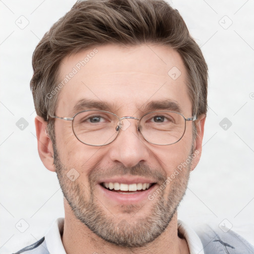 Joyful white adult male with short  brown hair and grey eyes