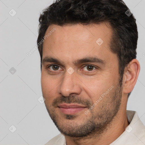 Joyful white adult male with short  brown hair and brown eyes