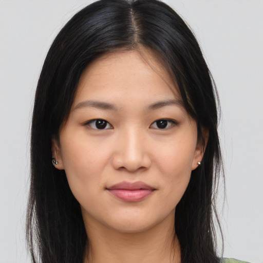 Joyful asian young-adult female with long  brown hair and brown eyes