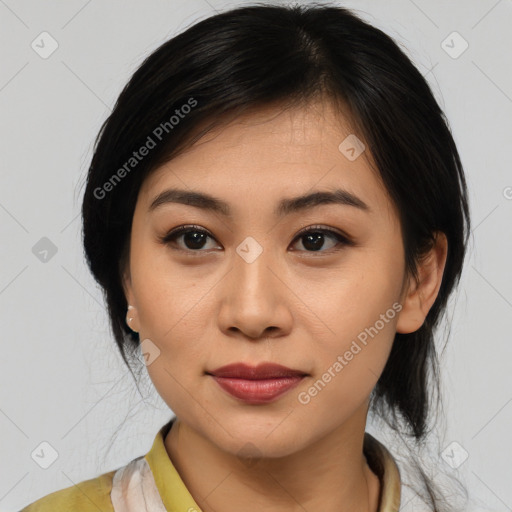 Joyful latino young-adult female with medium  brown hair and brown eyes