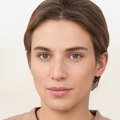 Neutral white young-adult female with short  brown hair and brown eyes