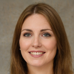 Joyful white young-adult female with long  brown hair and green eyes