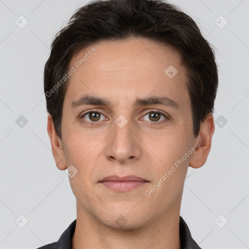 Joyful white adult male with short  brown hair and brown eyes